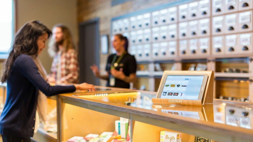 woman at cannabis dispensary counter