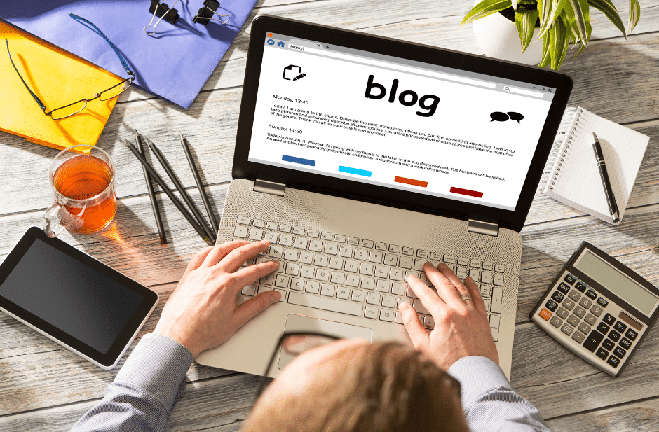 Content marketer writing a blog on their laptop